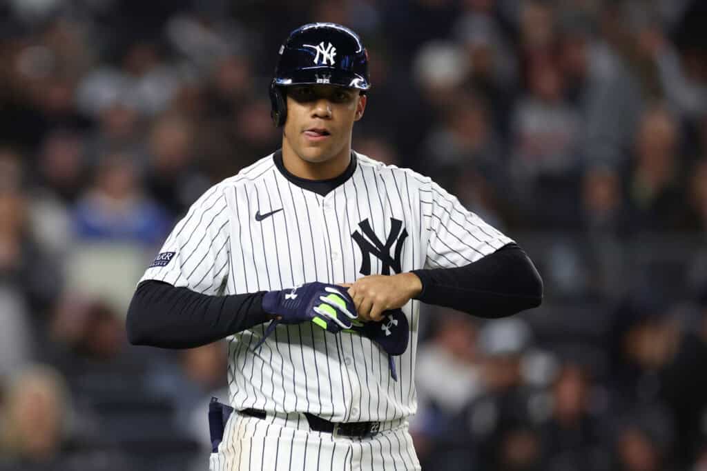 NEW YORK, NEW YORK - OCTOBER 14: Juan Soto #22 of the New York Yankees is walked to first base during the 4th inning of Game One of the American League Championship Series against the Cleveland Guardians at Yankee Stadium on October 14, 2024 in New York City.