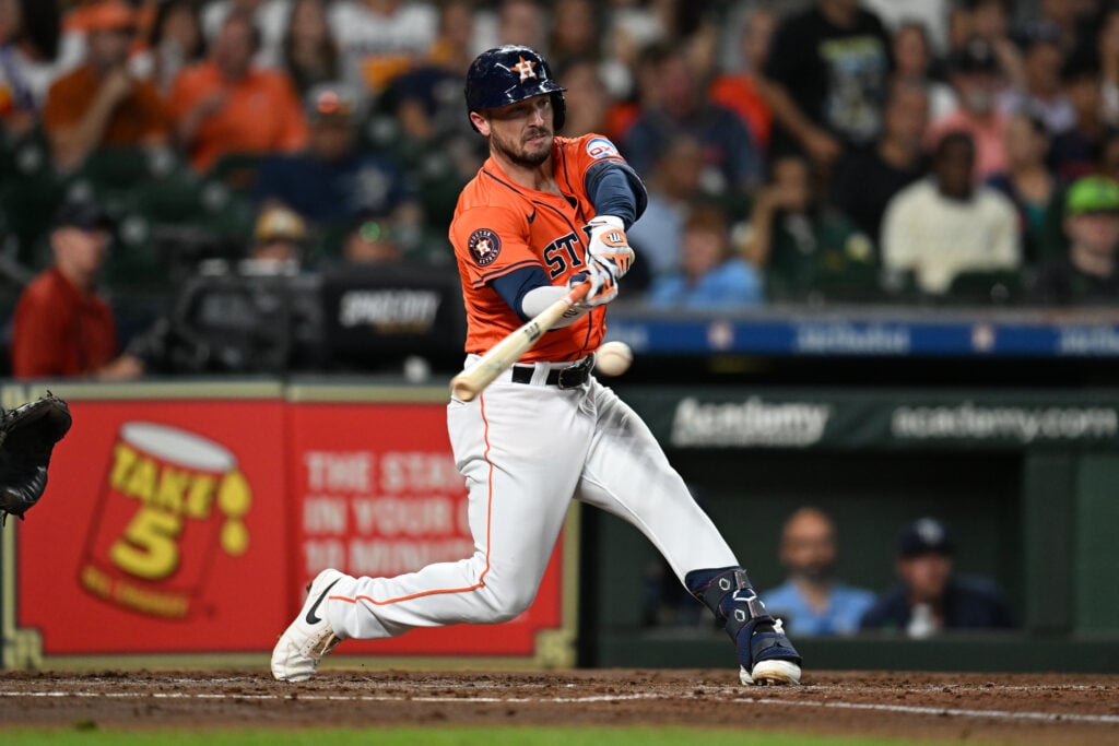 HOUSTON, TEXAS - AUGUST 2: Alex Bregman #2 of the Houston Astros hits an infield single against the Tampa Bay Rays during the third inning at Minute Maid Park on August 2, 2024 in Houston, Texas.