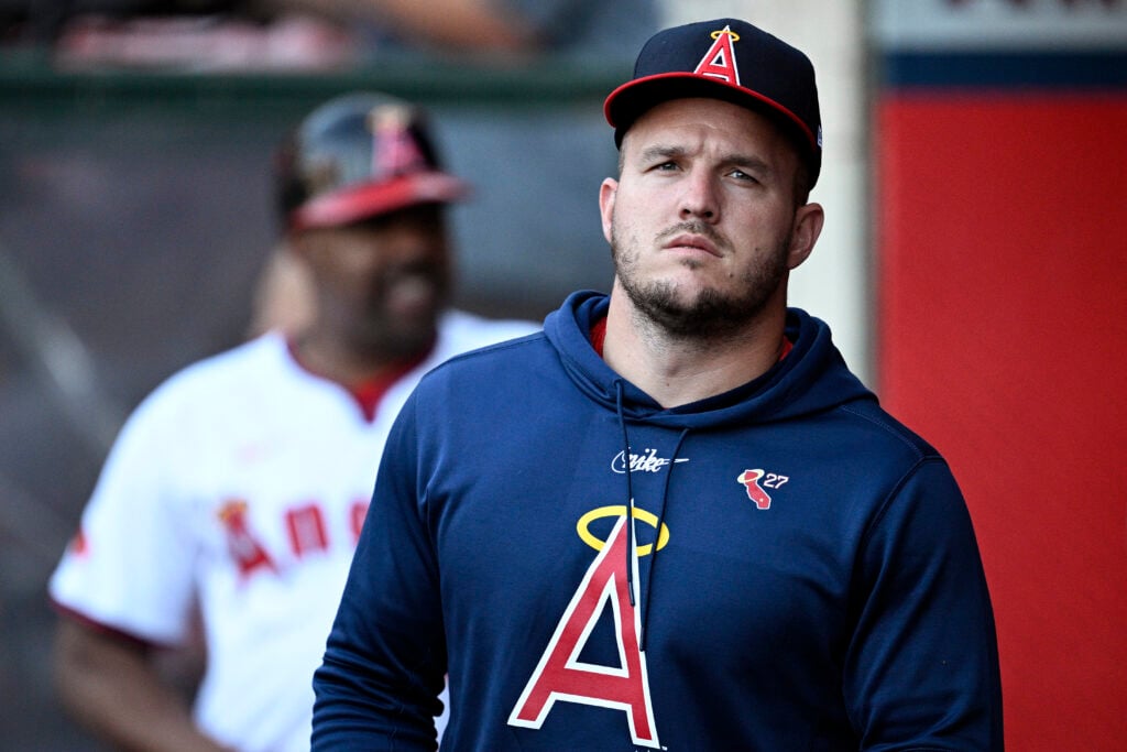 ANAHEIM, CALIFORNIA - AUGUST 01: Mike Trout #27 of the Los Angeles Angels looks on from the dugout during the first inning against the Colorado Rockies at Angel Stadium of Anaheim on August 01, 2024 in Anaheim, California.