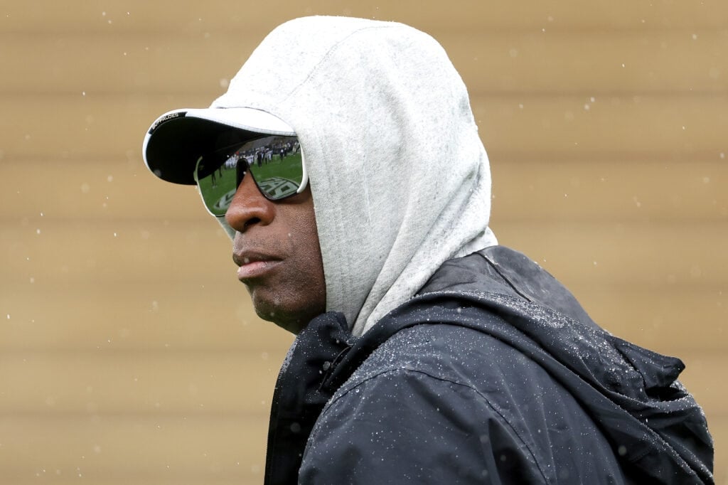 BOULDER, COLORADO - APRIL 27: Head coach Deion Sanders of the Colorado Buffaloes watches as his team warms-up prior to their spring game at Folsom Field on April 27, 2024 in Boulder, Colorado.